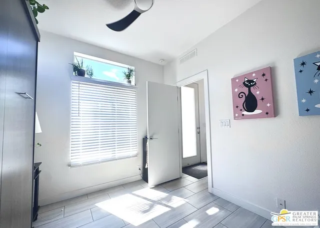 a view of a hallway with washer and dryer
