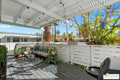 a view of a balcony with chairs