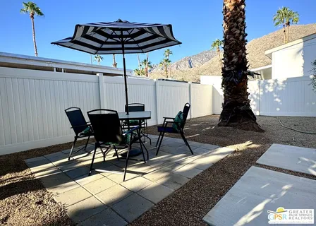 a house with outdoor seating space