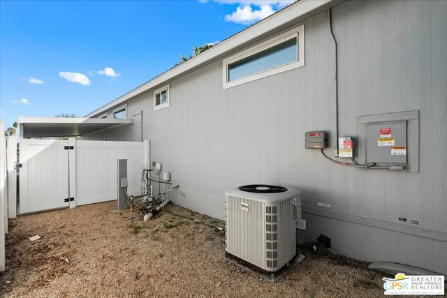 a view of a house with a fountain in a yard