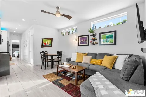 a dining room with furniture and window