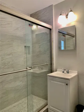 a bathroom with a sink and mirror