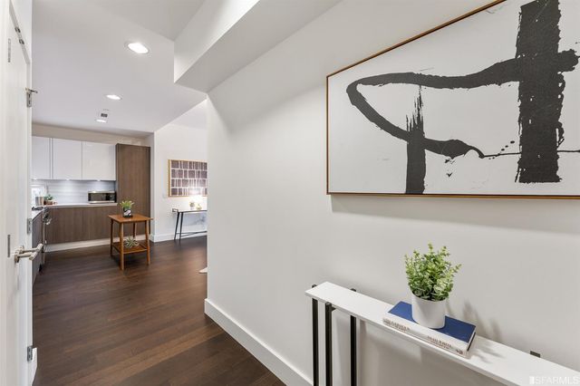 a view of kitchen with furniture and wooden floor
