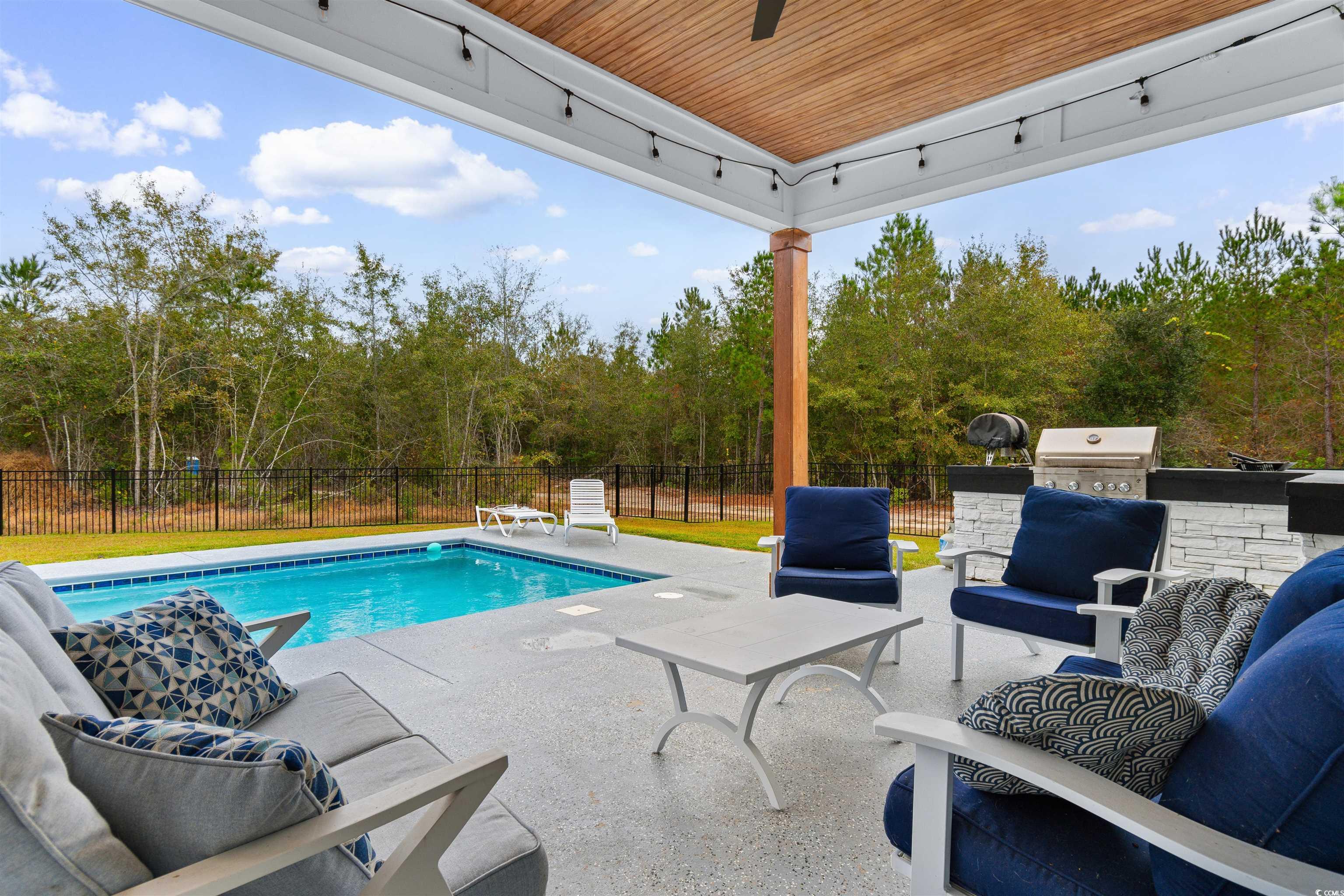 4785 Valley Forge Road Aynor, SC 29511 - Photo 24 of 40 View of swimming pool with an outdoor living space