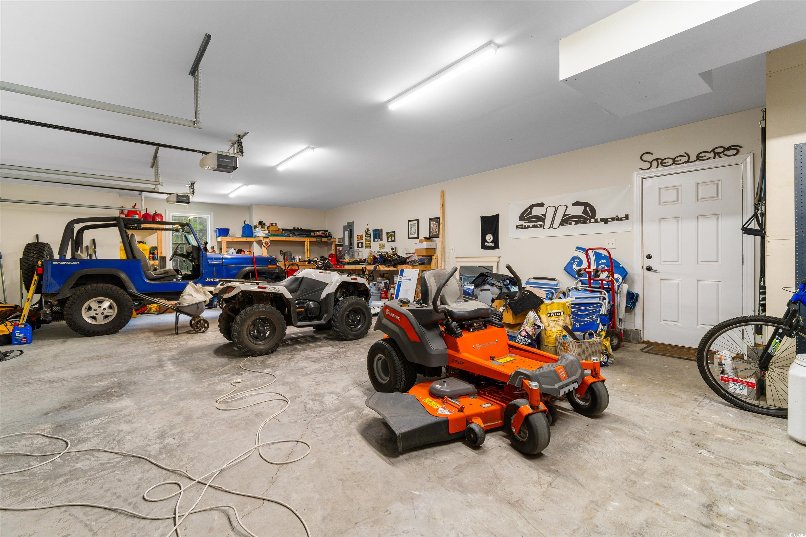 4785 Valley Forge Road Aynor, SC 29511 - Photo 25 of 40 Garage featuring a garage door opener
