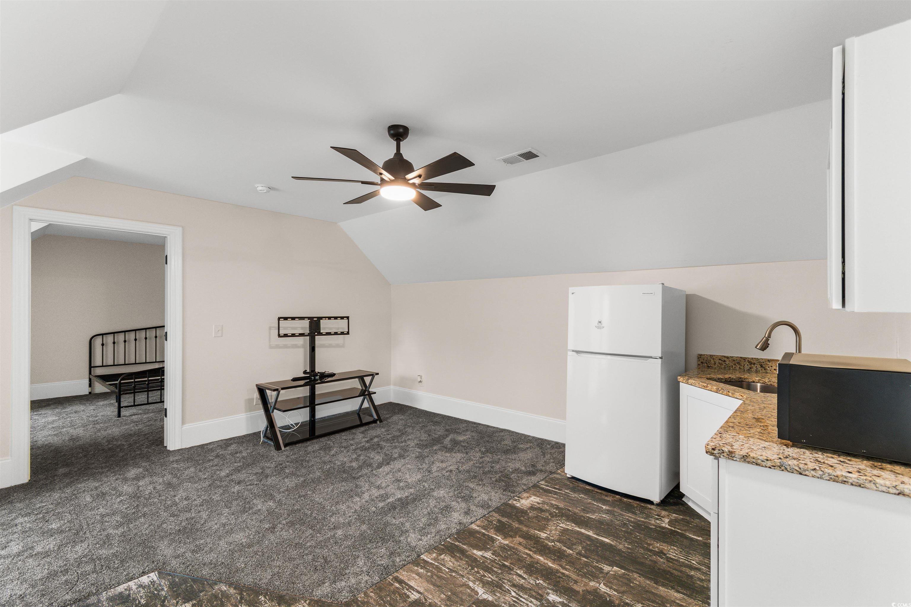 4785 Valley Forge Road Aynor, SC 29511 - Photo 27 of 40 Interior space with dark carpet, vaulted ceiling,