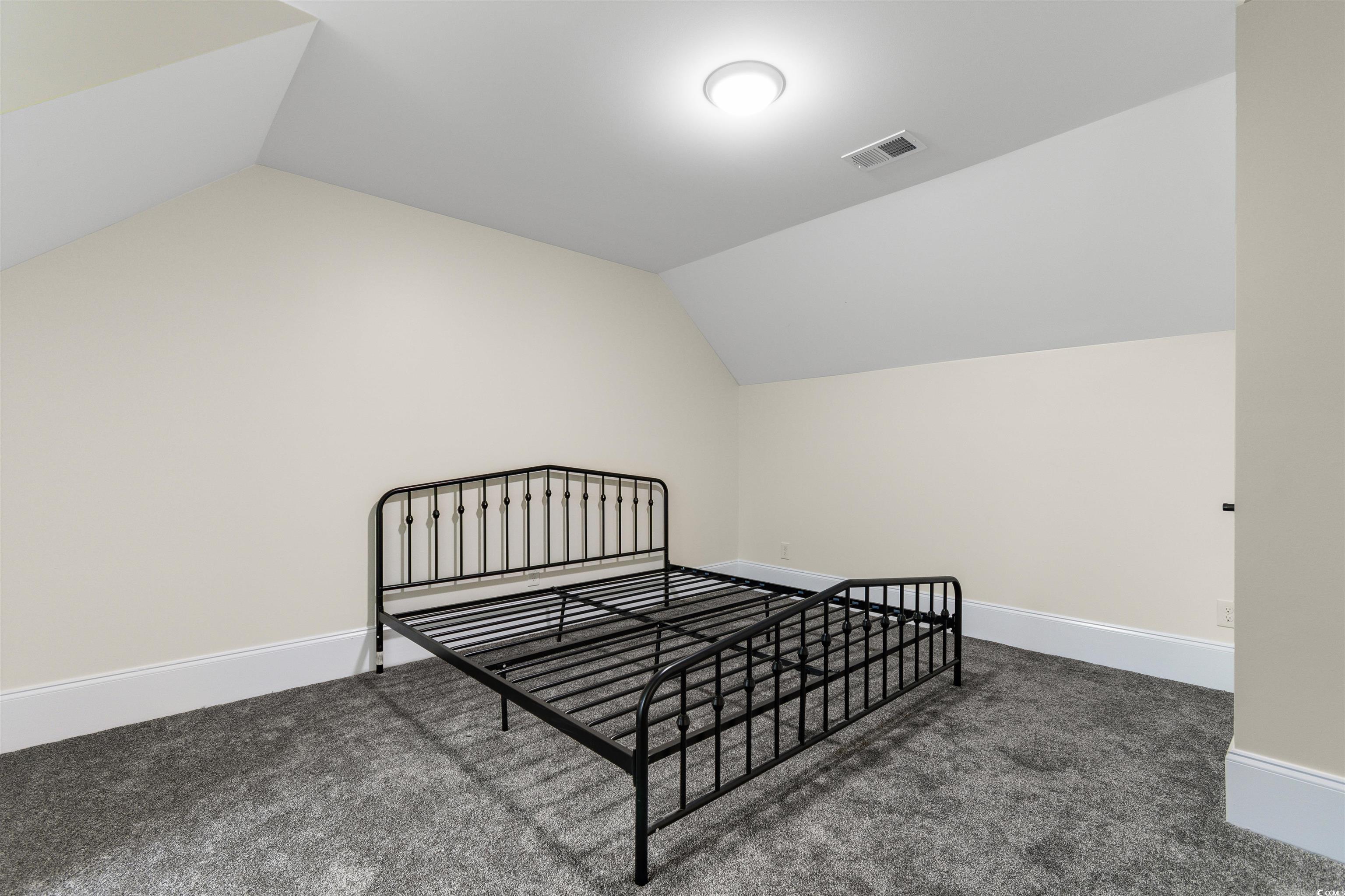 4785 Valley Forge Road Aynor, SC 29511 - Photo 29 of 40 Bedroom featuring dark colored carpet and vaulted