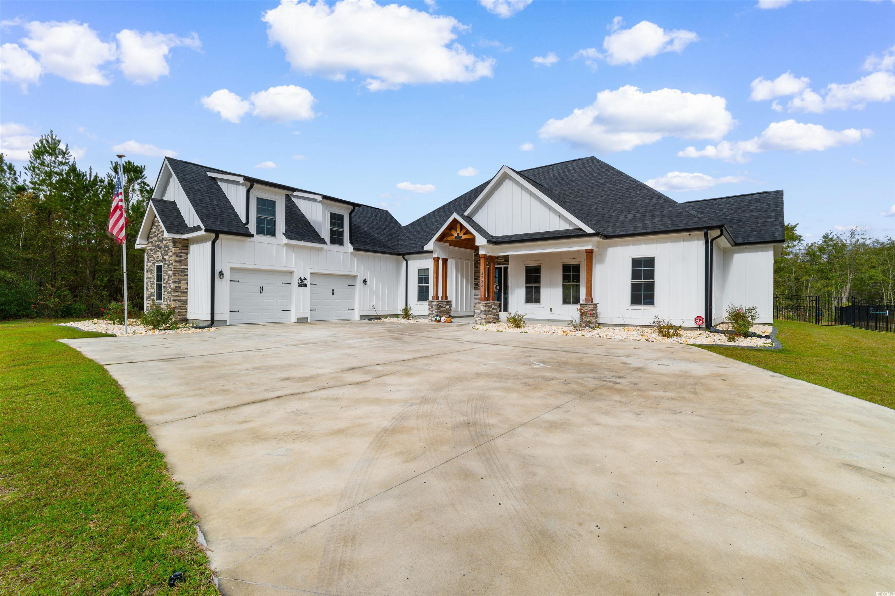 4785 Valley Forge Road Aynor, SC 29511 - Photo 3 of 40 View of front of home with covered porch, a garage