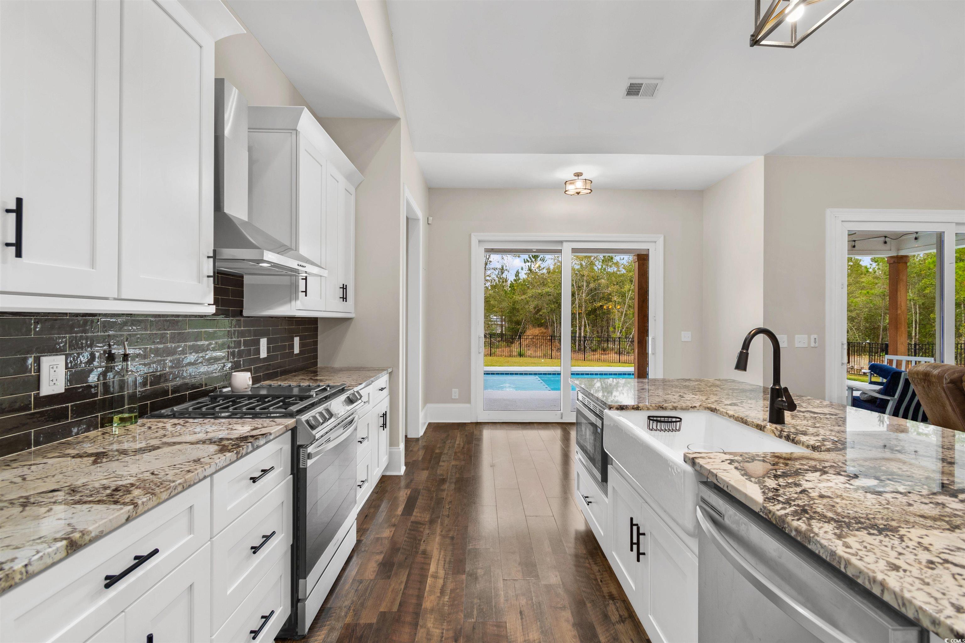 4785 Valley Forge Road Aynor, SC 29511 - Photo 5 of 40 Kitchen featuring light stone countertops, wall ch