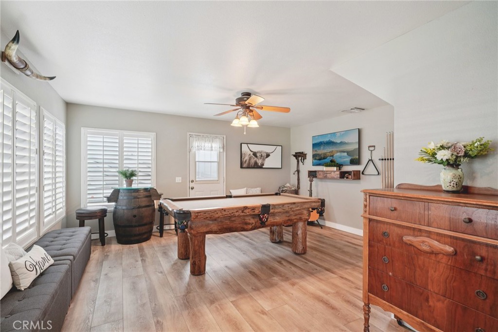 2821 Riding Ring Road Norco, CA 92860 - Photo 16 of 54 a living room with furniture and wooden floor