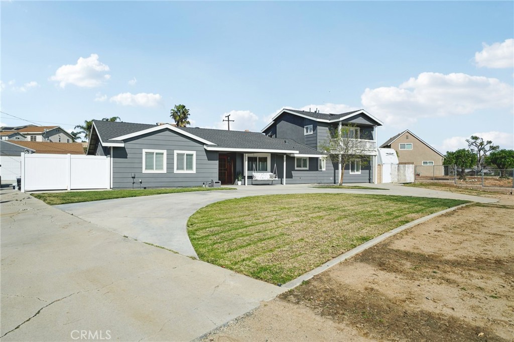 2821 Riding Ring Road Norco, CA 92860 - Photo 2 of 54 a front view of a house with a garden