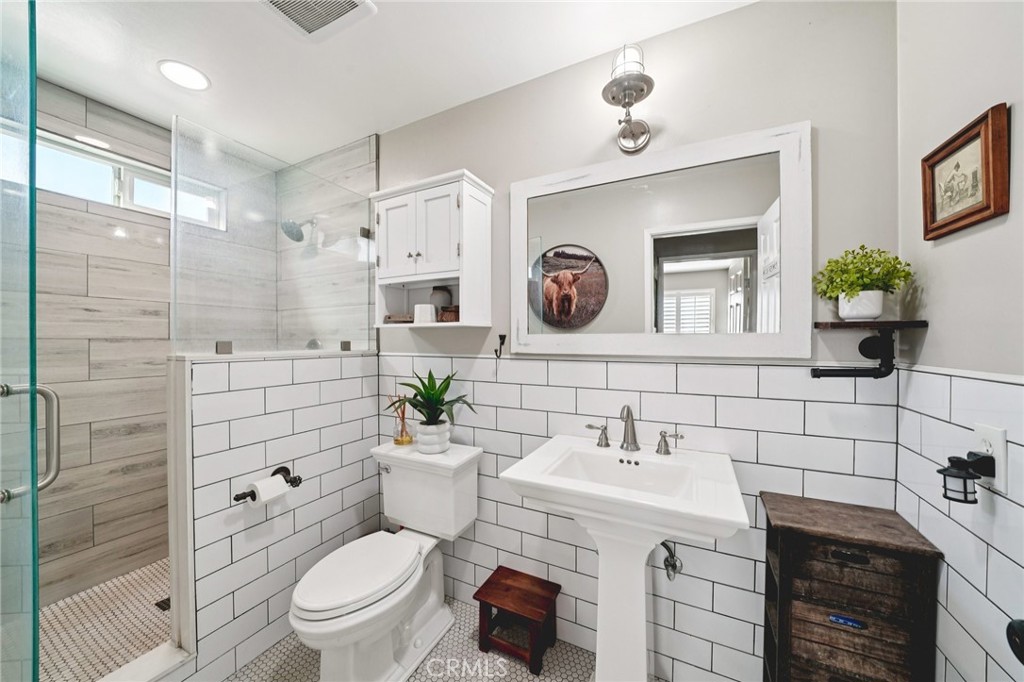 2821 Riding Ring Road Norco, CA 92860 - Photo 22 of 54 a bathroom with a sink a toilet and shower