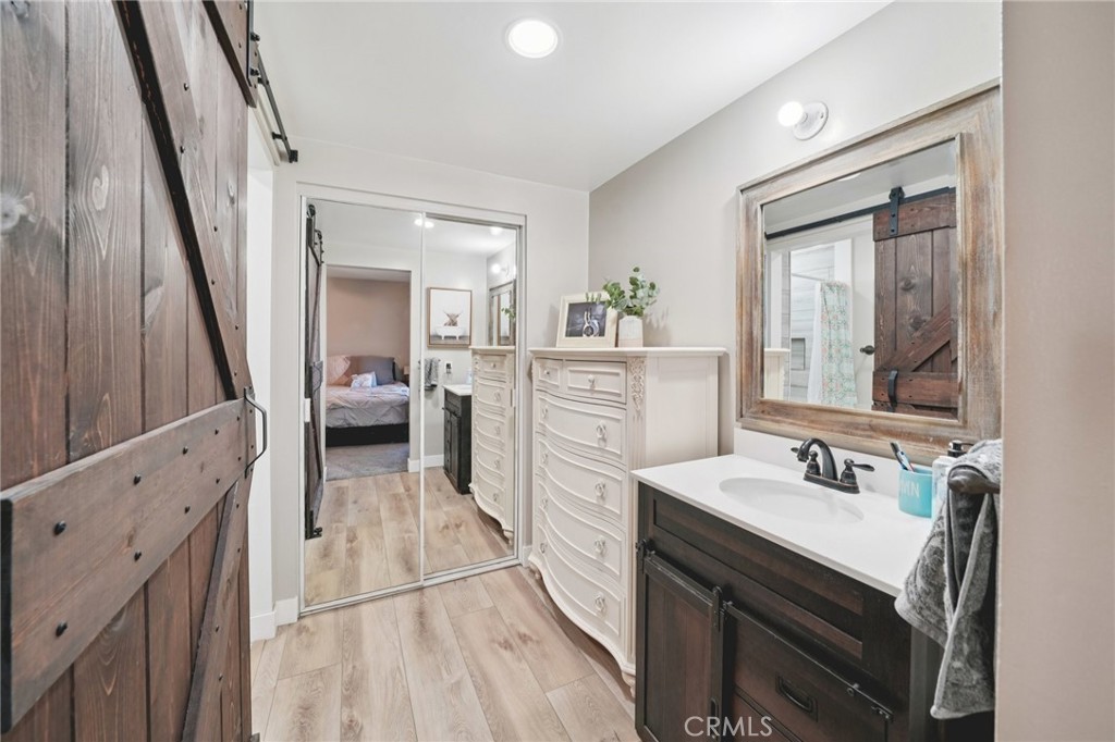 2821 Riding Ring Road Norco, CA 92860 - Photo 25 of 54 a bathroom with a sink a mirror and a vanity