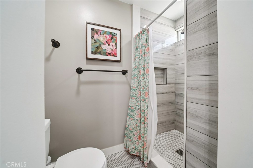 2821 Riding Ring Road Norco, CA 92860 - Photo 26 of 54 a bathroom with a shower and toilet