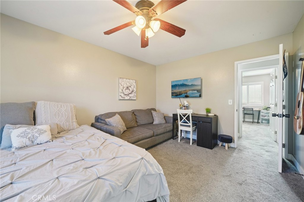 2821 Riding Ring Road Norco, CA 92860 - Photo 27 of 54 a bedroom with a bed and ceiling fan