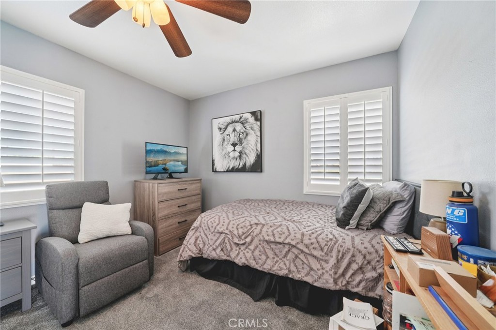 2821 Riding Ring Road Norco, CA 92860 - Photo 28 of 54 a bedroom with a bed and a couch