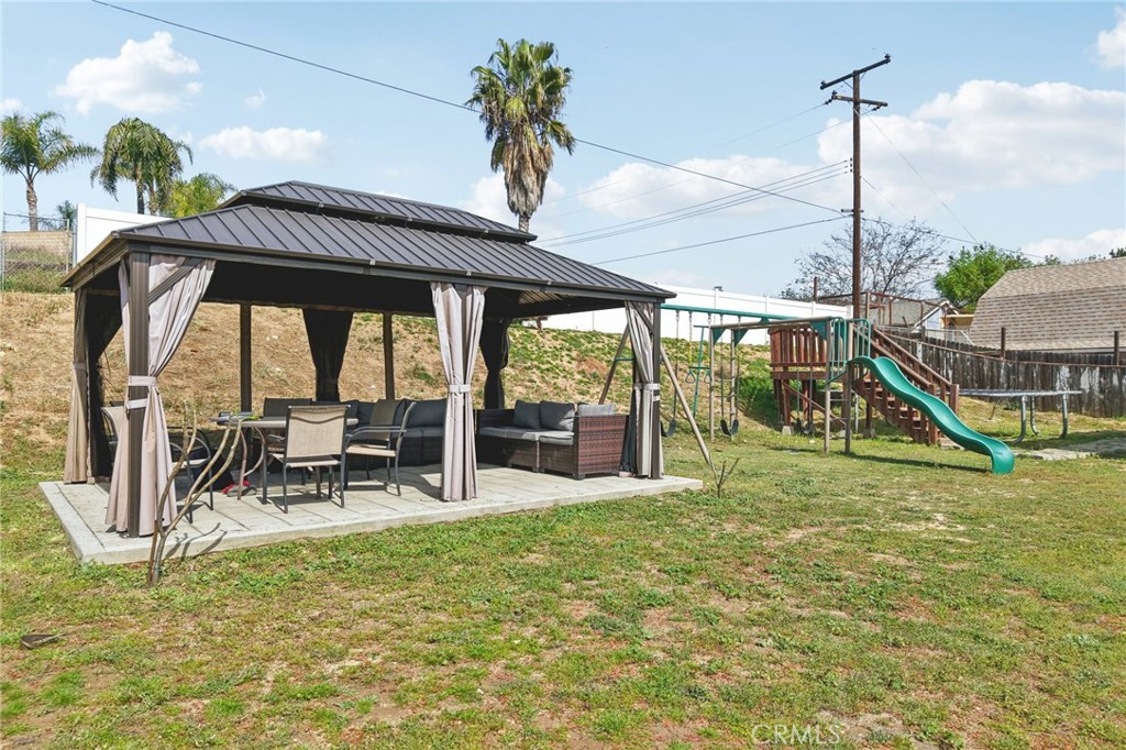 2821 Riding Ring Road Norco, CA 92860 - Photo 39 of 54 a view of a swimming pool with a bench and lawn chairs