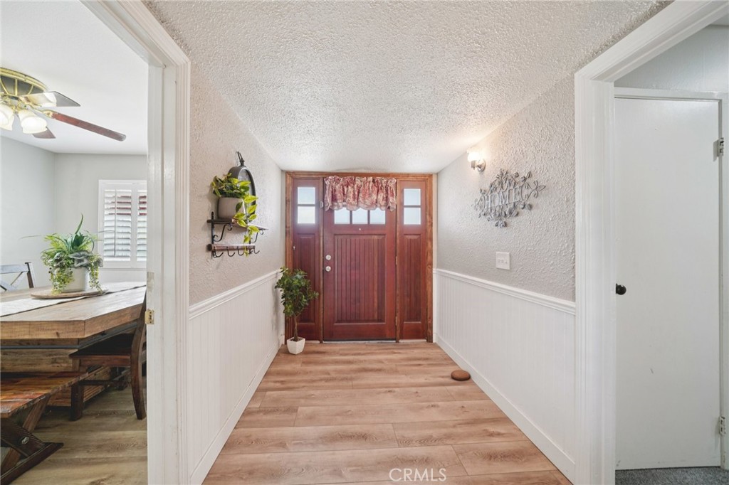 2821 Riding Ring Road Norco, CA 92860 - Photo 4 of 54 a view of a hallway view with wooden floor and staircase