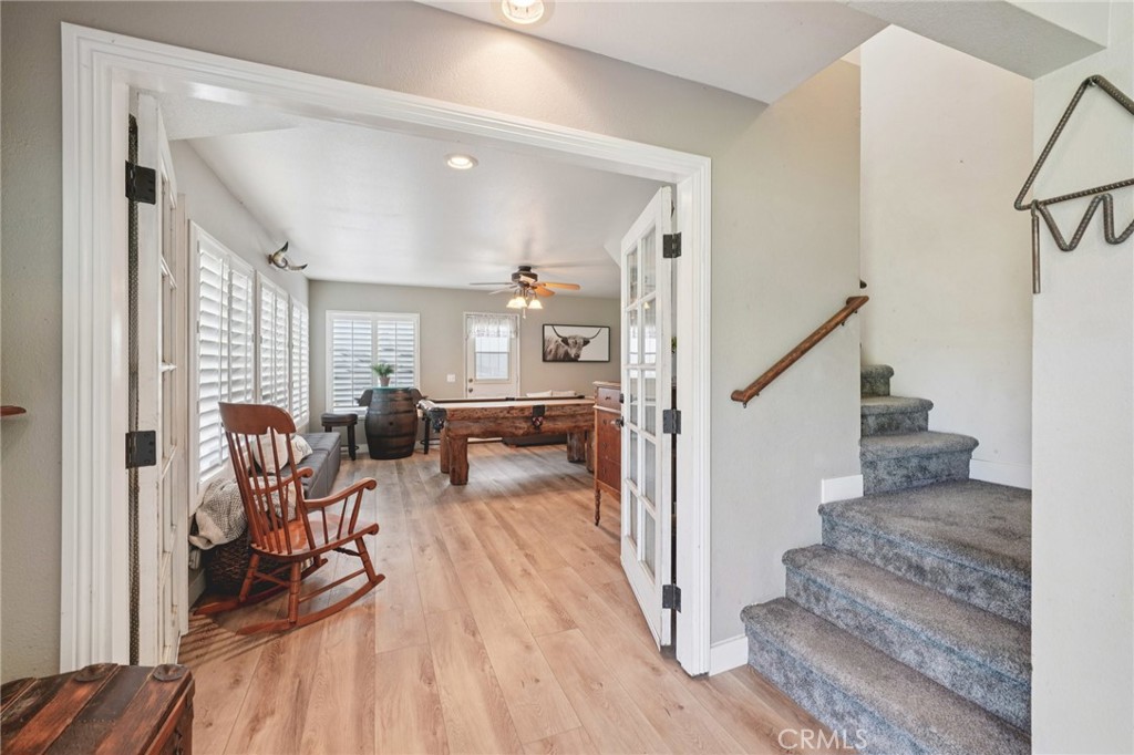 2821 Riding Ring Road Norco, CA 92860 - Photo 5 of 54 a view of a livingroom with furniture wooden floor and windows