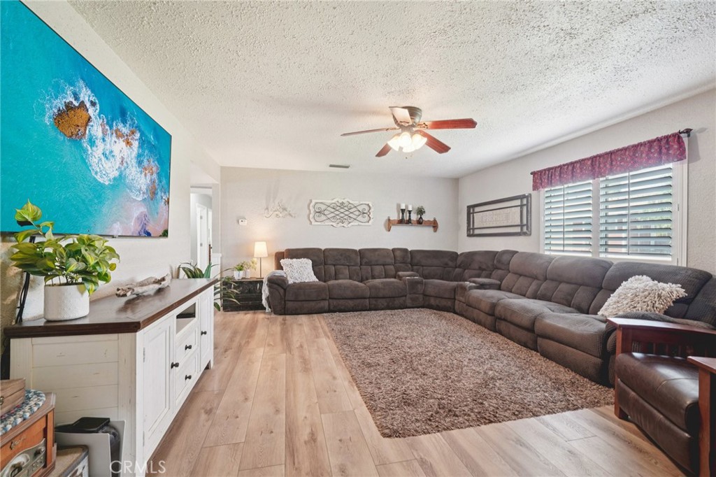 2821 Riding Ring Road Norco, CA 92860 - Photo 7 of 54 a living room with furniture and a chandelier