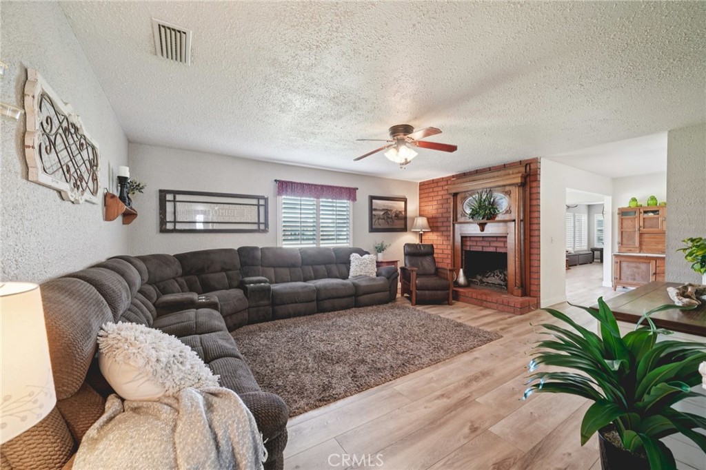 2821 Riding Ring Road Norco, CA 92860 - Photo 8 of 54 a living room with furniture ceiling fan and a rug