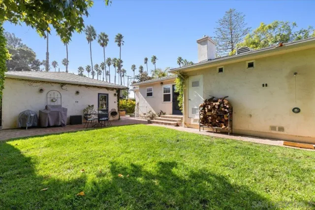 a front view of a house with a yard and a garage