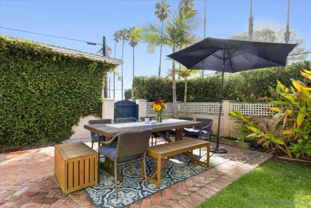 a view of an outdoor sitting area with furniture