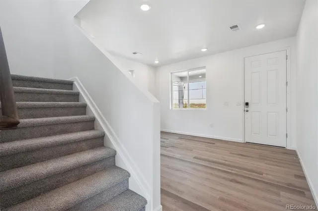 a view of entryway with wooden floor