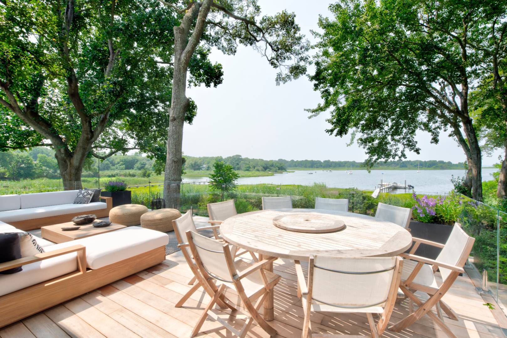 a view of a patio with furniture and a lake view