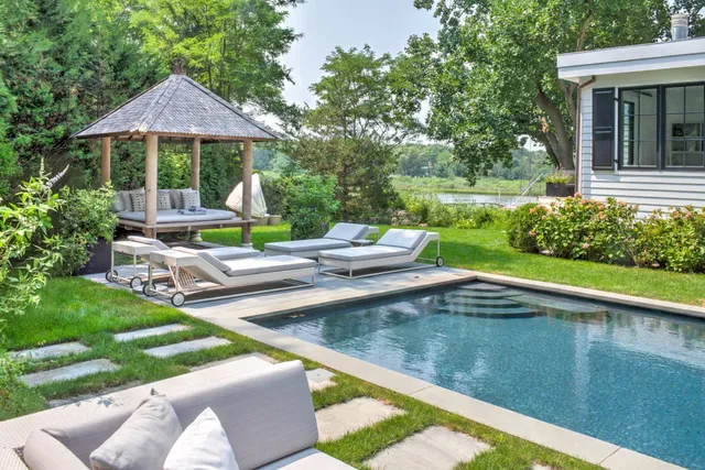 a view of a patio with chairs and a yard