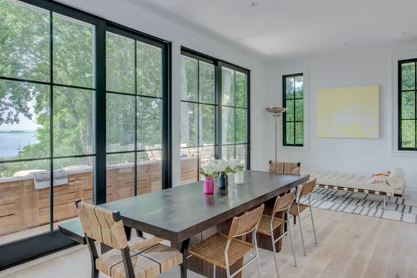 a view of a dining room with furniture and window