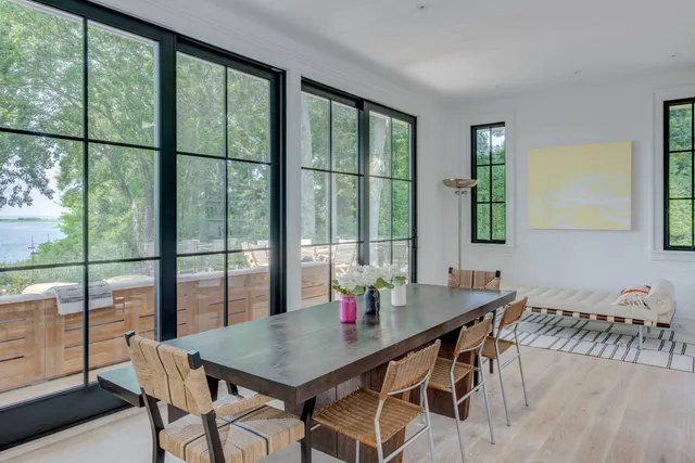 a view of a dining room with furniture and window