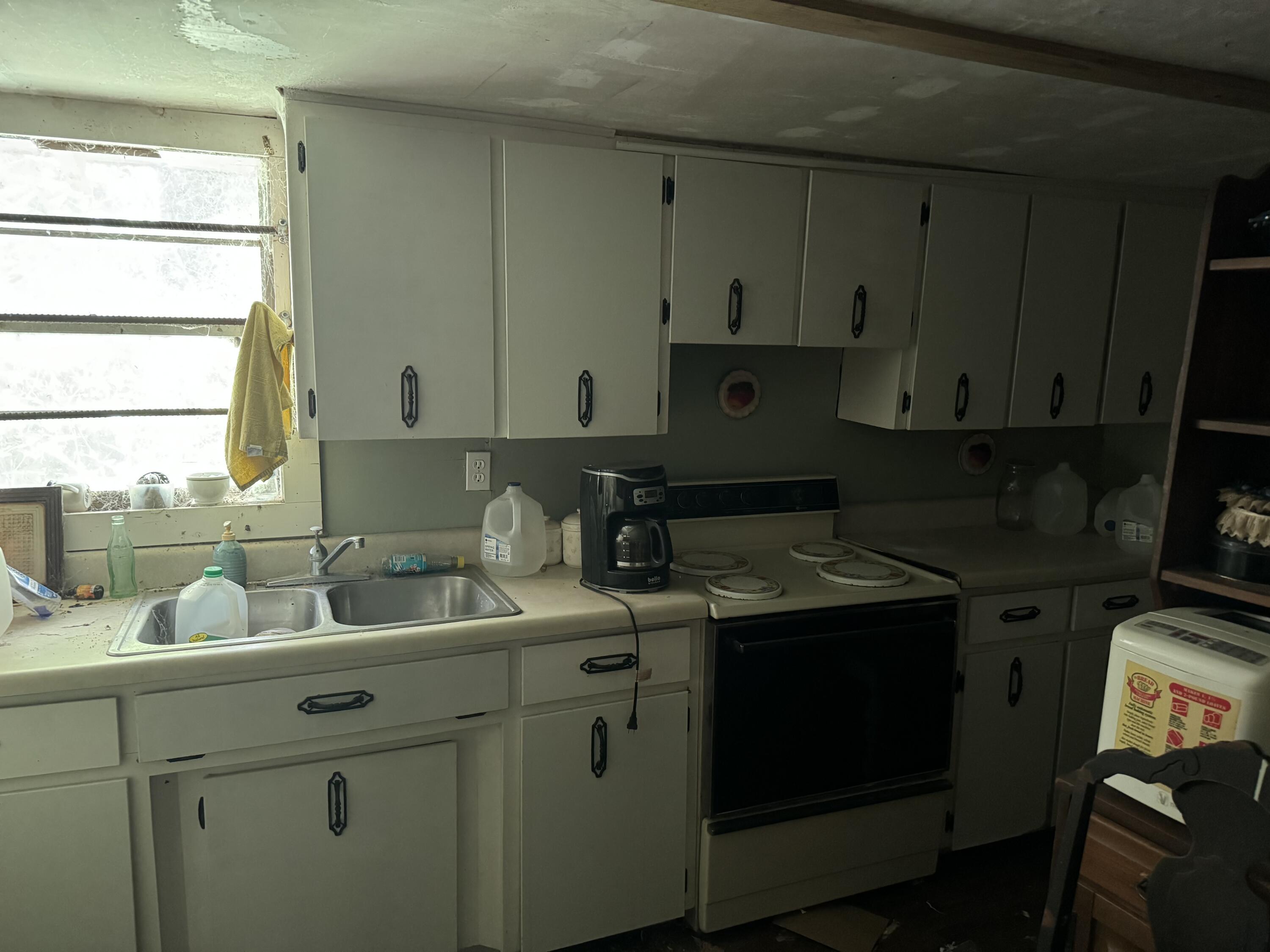 3956 Cook Road Westville, FL 32464 - Photo 11 of 15 a kitchen with a sink and cabinets