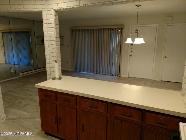 a view of a kitchen with a refrigerator a sink and a dishwasher