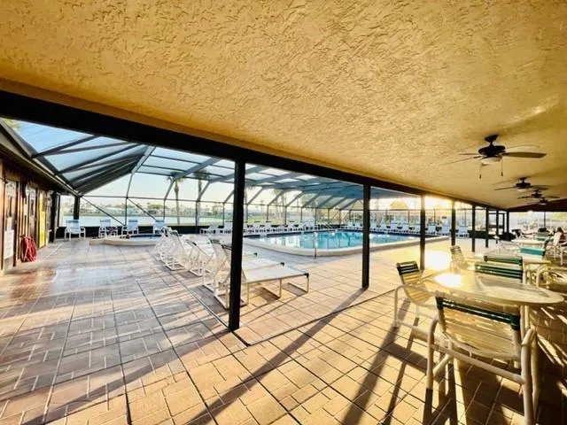 a view of swimming pool with outdoor seating