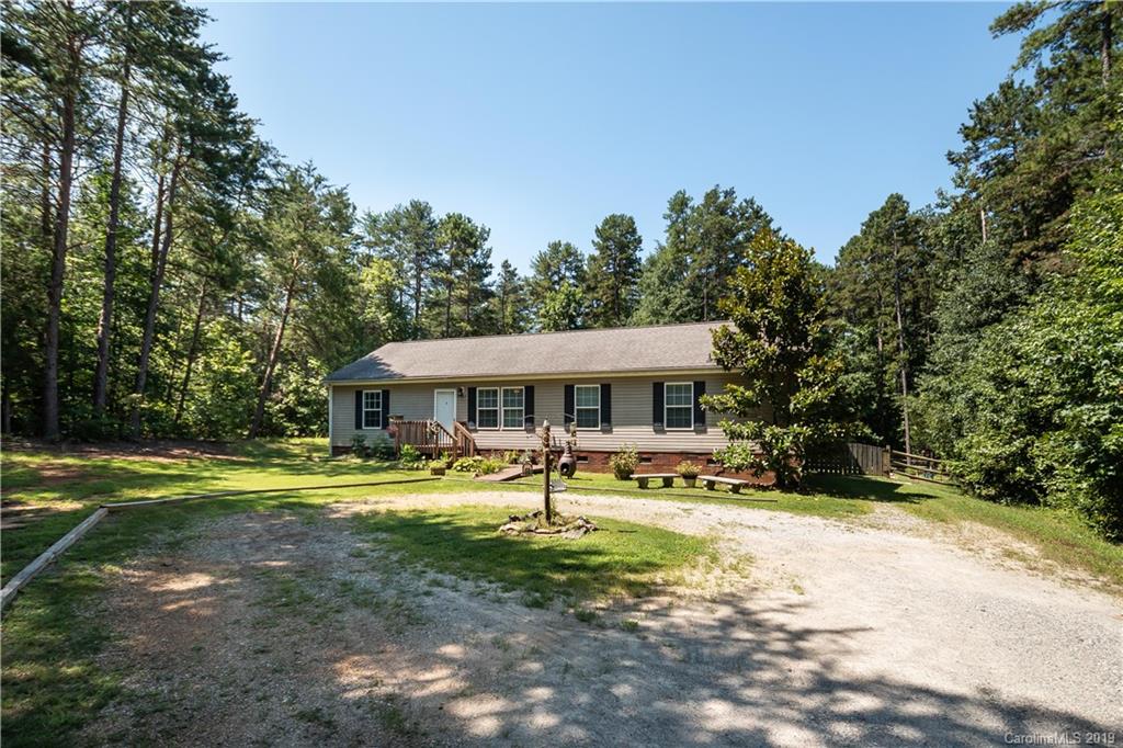 2843 Fay Jones Road Denver, NC 28037 - Photo 3 of 27 a view of a house with garden and trees
