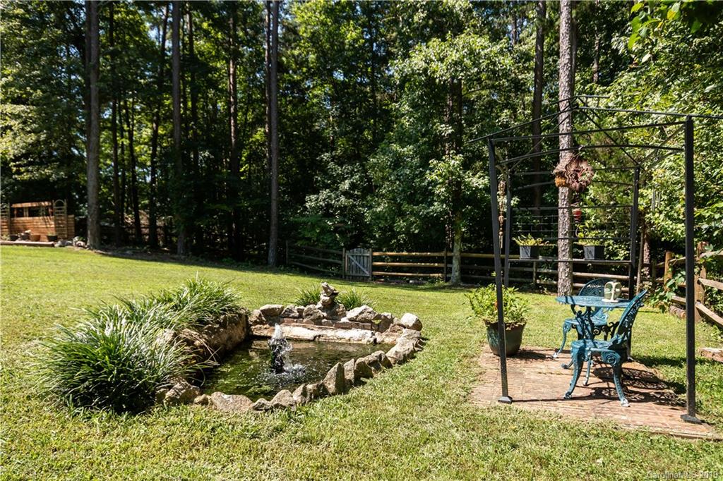 2843 Fay Jones Road Denver, NC 28037 - Photo 23 of 27 a view of a garden with a patio