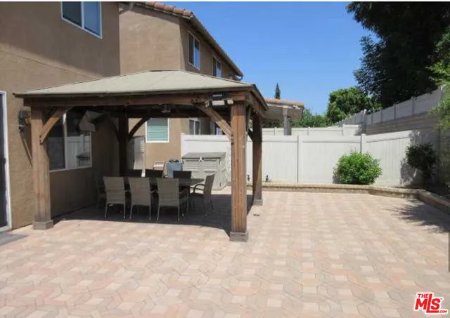 a view of a swimming pool with a table and chairs