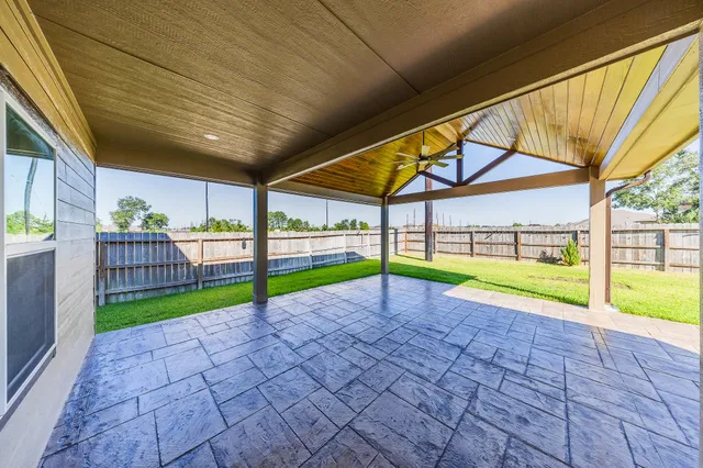 a view of a backyard with swimming pool