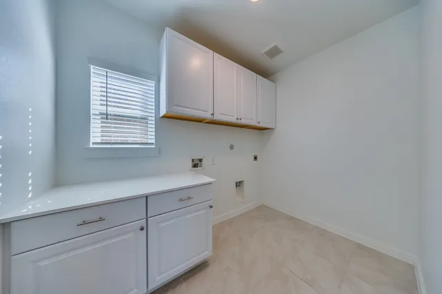 a view of cabinets and window