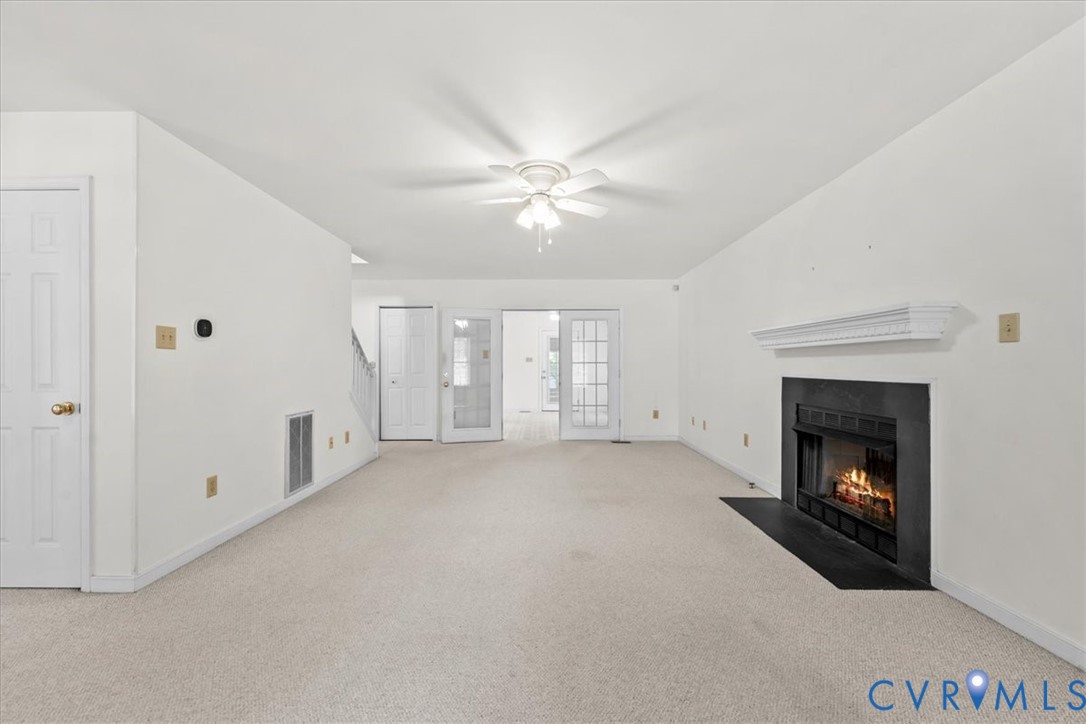2924 Warfield Ridge Terrace Chester, VA 23831 - Photo 10 of 38 Carpeted living area featuring a central ceiling f