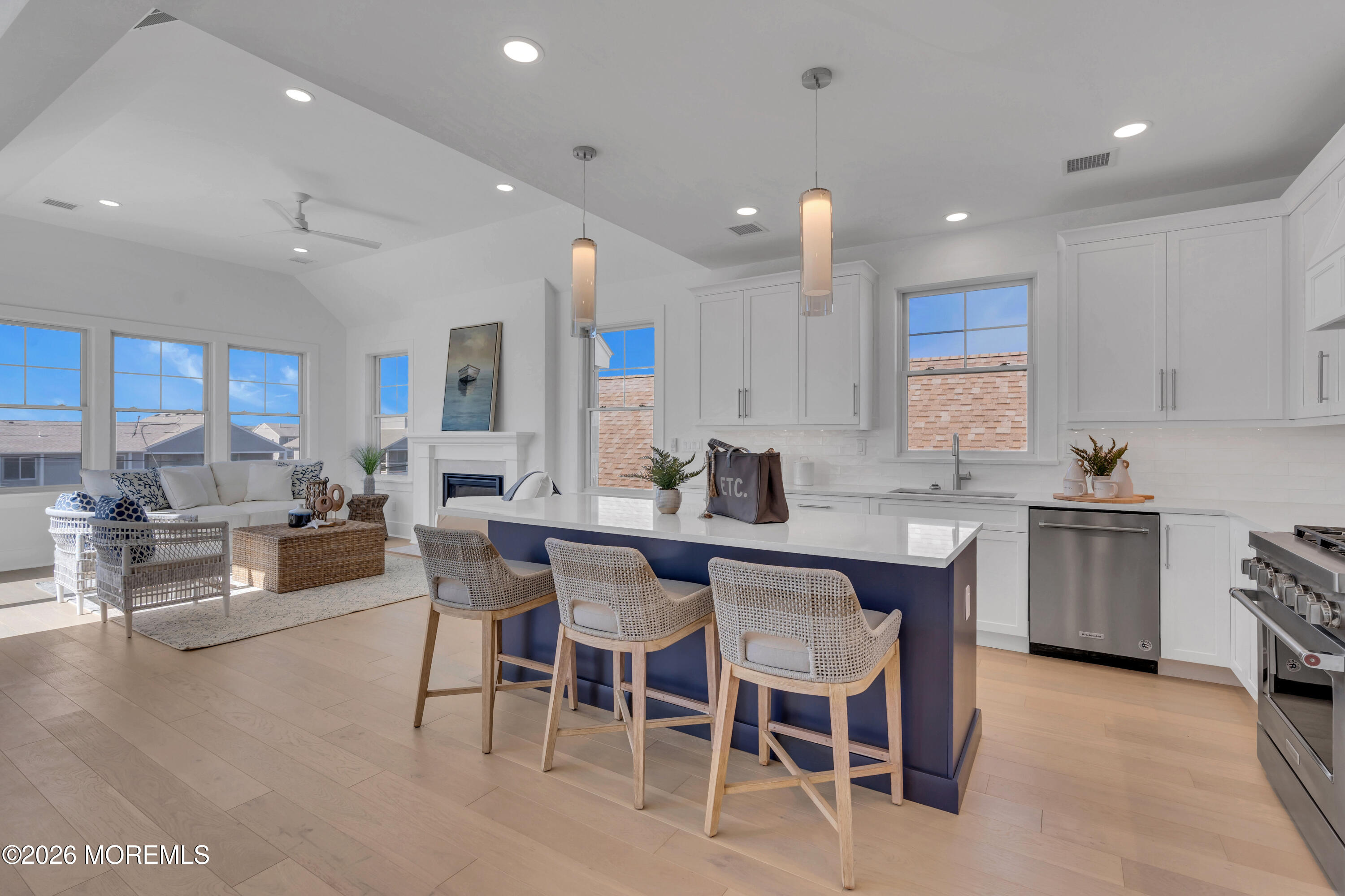 2000 Highway 35 Seaside Heights, NJ 08751 - Photo 4 of 26 a kitchen with a dining table chairs and white cabinets