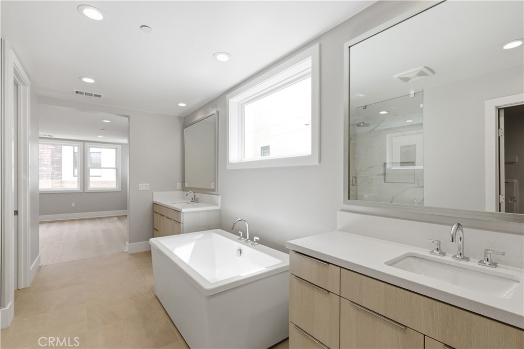 156 Apron Irvine, CA 92618 - Photo 20 of 40 a view of a bathroom sink and a window