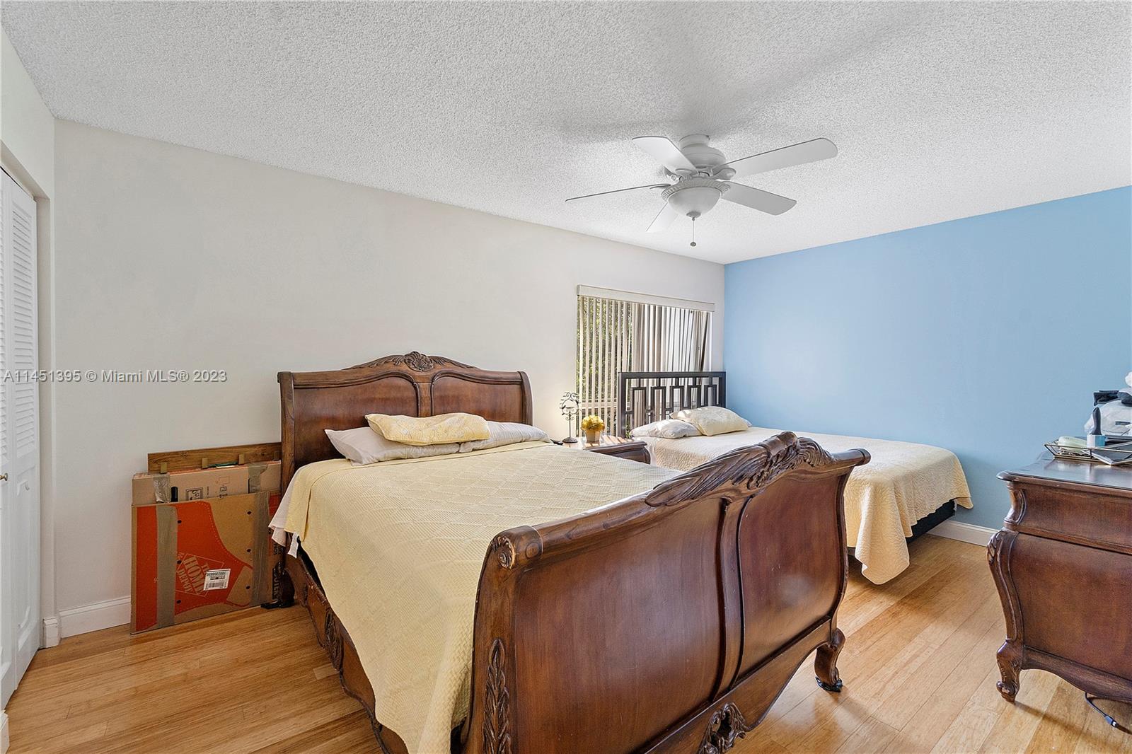 6157 Old Court Road, Unit 225 Boca Raton, FL 33433 - Photo 11 of 27 a bedroom with a bed and a chandelier