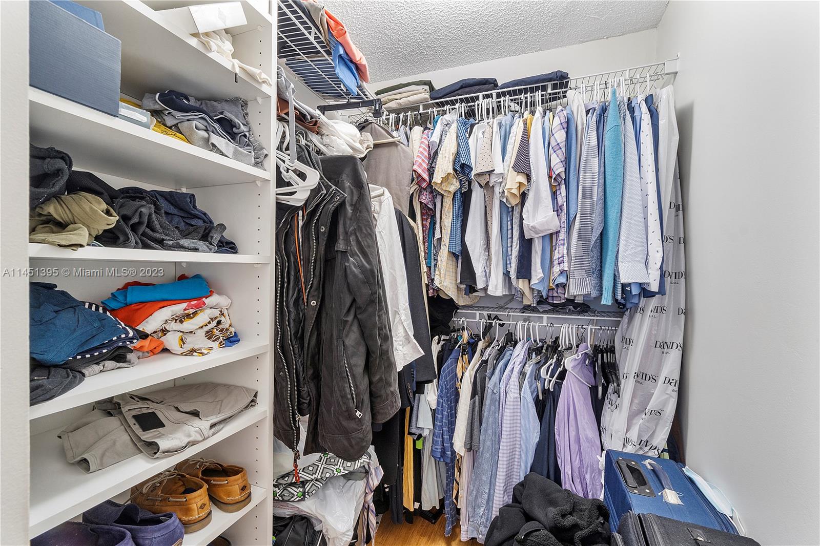 6157 Old Court Road, Unit 225 Boca Raton, FL 33433 - Photo 13 of 27 a view of walk in closet with clothes and shoes