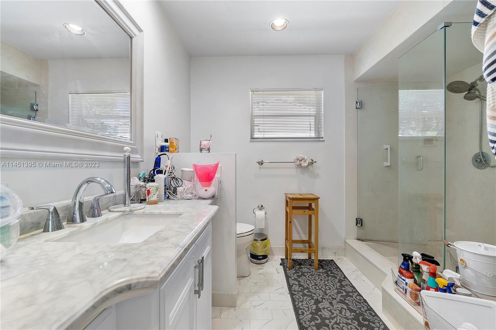 6157 Old Court Road, Unit 225 Boca Raton, FL 33433 - Photo 15 of 27 a bathroom with a sink double vanity and a shower