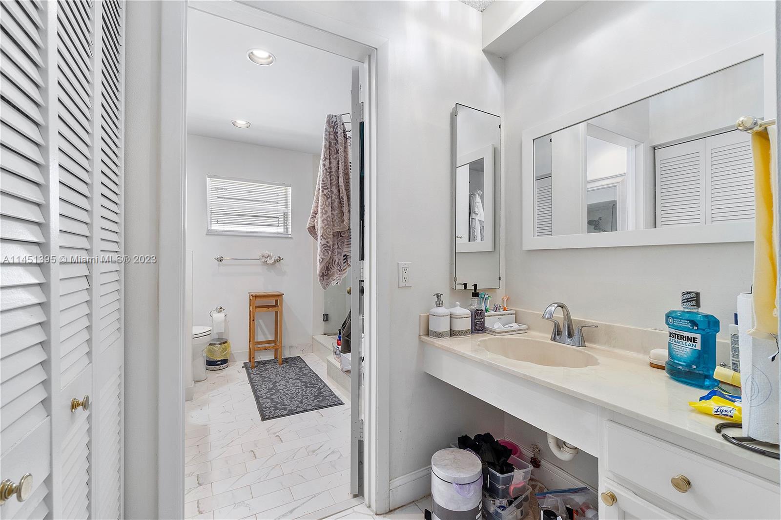 6157 Old Court Road, Unit 225 Boca Raton, FL 33433 - Photo 17 of 27 a bathroom with a sink double vanity and a mirror