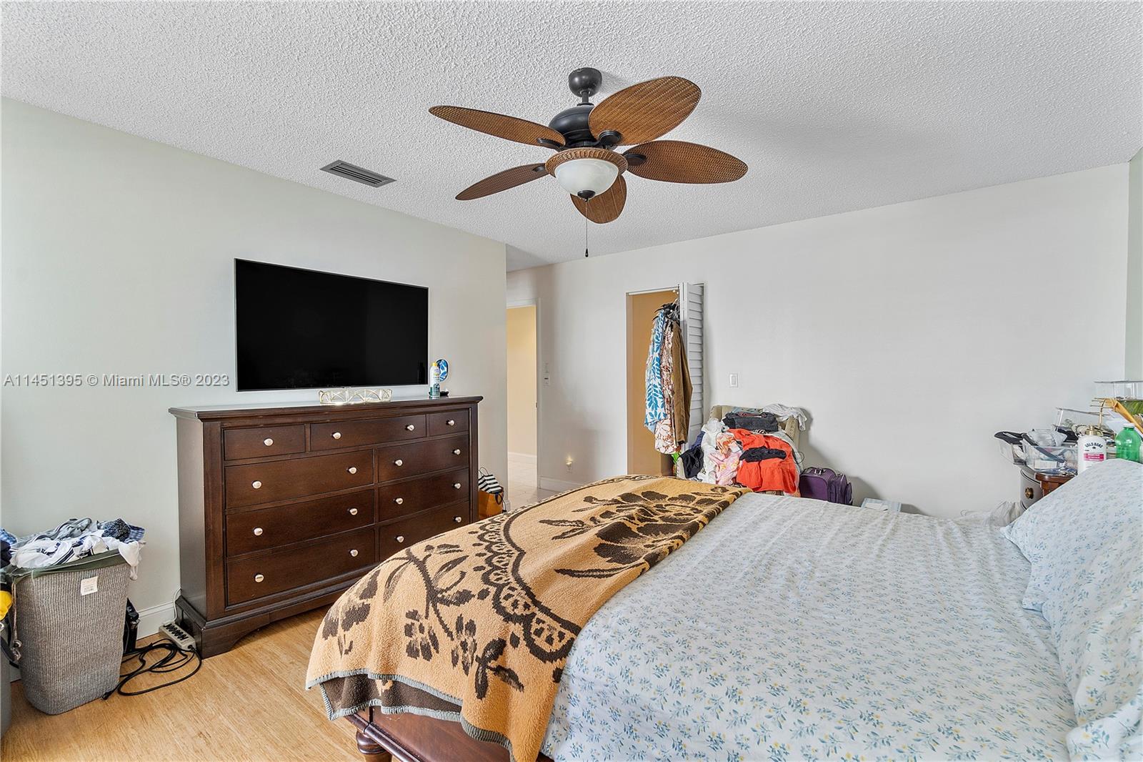 6157 Old Court Road, Unit 225 Boca Raton, FL 33433 - Photo 18 of 27 a bedroom with a bed and a flat screen tv