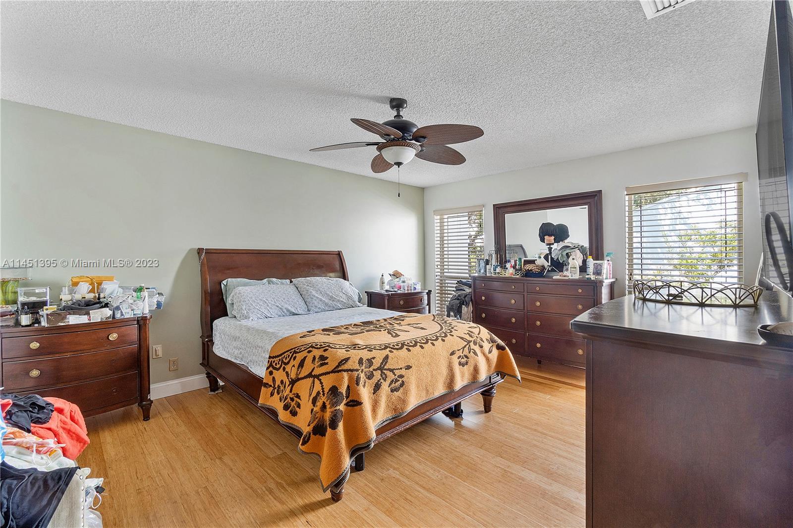 6157 Old Court Road, Unit 225 Boca Raton, FL 33433 - Photo 19 of 27 a bedroom with a bed and a chandelier