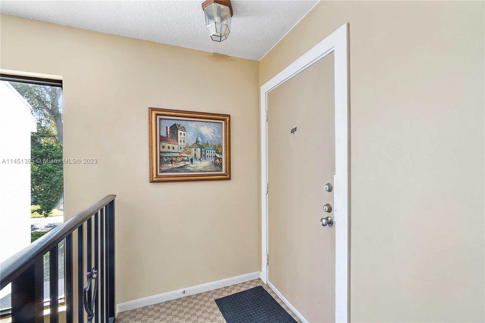6157 Old Court Road, Unit 225 Boca Raton, FL 33433 - Photo 3 of 27 a view of a hallway with front door